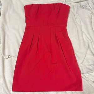 Tube top dress above the knees with pockets fuchsia pink